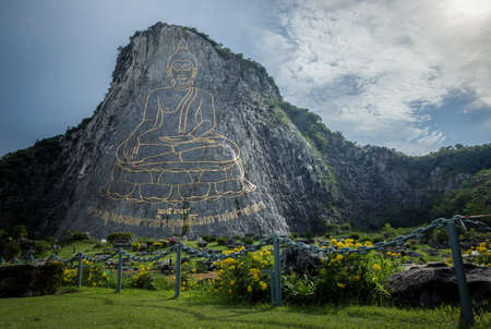 The Buddha at the cliff in thailand.の写真素材