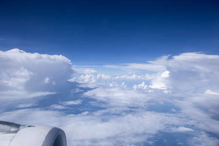 Sky and clouds in the air, good height from the top of the plane.の写真素材