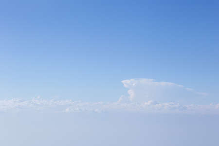 Sky and clouds in the air, good height from the top of the plane.の写真素材