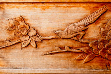 Abstract art on wood - Bird with flowerの写真素材