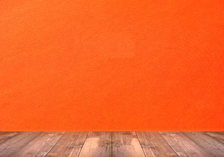 abstract Orange wall with wood floorの写真素材