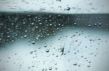 Blurred raindrop to the windowの写真素材