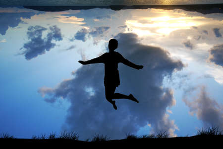 Freedom and Enjoyment concept - Happy lady jumping ,dancing with beautiful Earth perspective.の写真素材