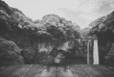 Blurred Cheonjiyeon Waterfall is a waterfall on Jeju Island, South Korea with wooden bridge.の写真素材