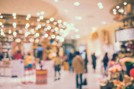Blurred tourists in shopping mall with bokeh - retro colorの写真素材