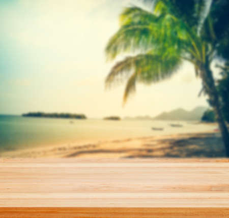 Sunset on Samui beach,Thailand with wooden table top - well use as background and present products.の写真素材
