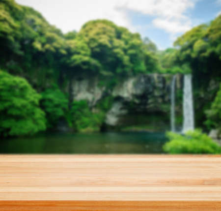 Table top counter with Cheonjiyeon Waterfall in Jeju Island - well used for present and promote products.の写真素材