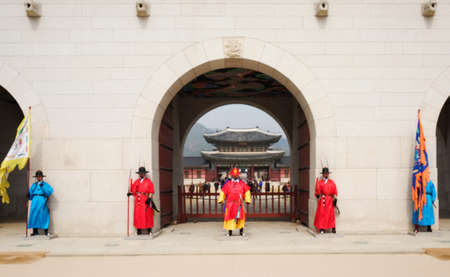 SEOUL, KOREA - MARCH 3, 2016: Blurred Undefiend wall keeper at gate of Gyeongbokgung Palace in Seoul - South Korea.のeditorial素材