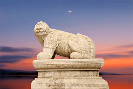 Haechi,Statue of a mythological lion-like animal with sunset.のeditorial素材