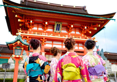 Young girl wearing Japanese kimono standing in front of japanese Temple.のeditorial素材