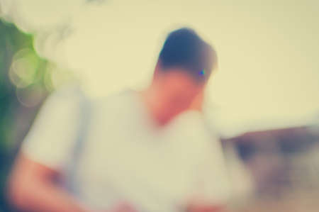 Young man looking forward to the sunset in City.の写真素材