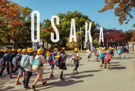 OSAKA,JAPAN, MARCH 12, 2015: Japanese young elementary students are having field trip in Osaka Castle, Japan.のeditorial素材