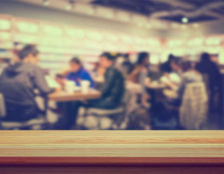 Table top counter with blurred Coffee shop - well used for present and promote products.の写真素材