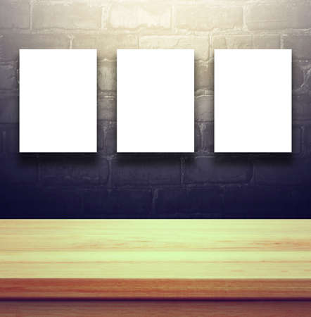 Closeup Clear wooden studio background with empty billboard on black brick wall well use for present products. Vintage Toned.の写真素材