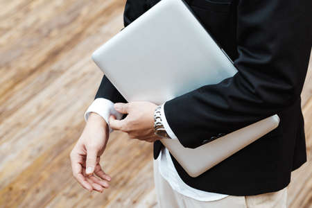 Luxury business man with top-class laptop and watch.の写真素材