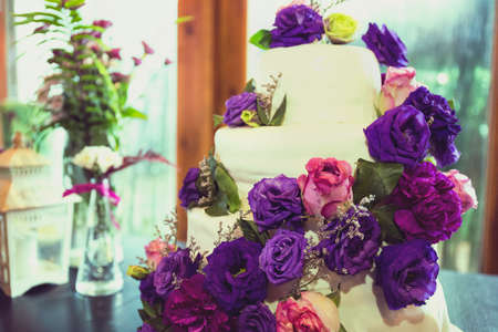Wedding cake with Botanical purple flower and Vintage tone.の写真素材