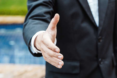 Business and office concept - Business man shaking hands in Luxury property.の写真素材
