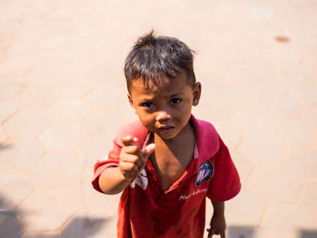 CAMBODIA - FEBUARY 18,2017 : Children in Cambodia begging for money on the roadside in cambodiaのeditorial素材