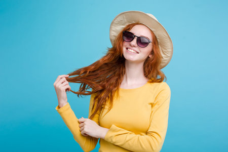 Travel concept - Close up Portrait young beautiful attractive redhair girl wtih trendy hat and...