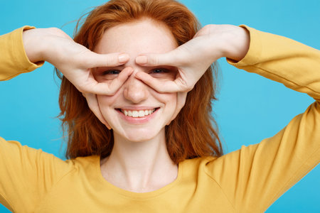 Fun and People Concept - Headshot Portrait of happy ginger red hair girl with freckles smiling and...