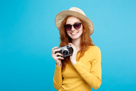 Travel concept - Close up Portrait young beautiful attractive redhair girl with trendy hat ,sunglass...