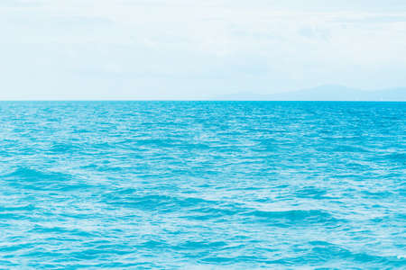 Bright Blue ocean with smooth wave background.の写真素材