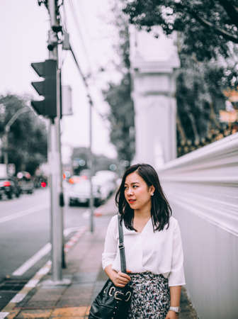 Young Asian beautiful businesswoman walking on street hurry to work.の写真素材