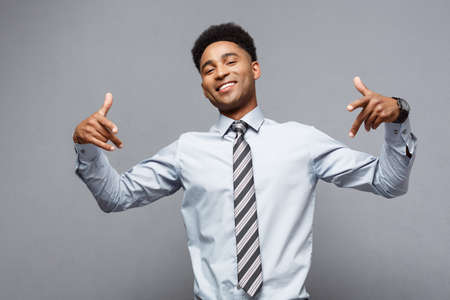 Business Concept - Confident happy young African American pointing two hands to himself.の写真素材
