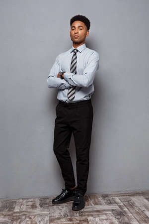 Business Concept - Full length portrait of confident african american businessman in the office.の写真素材