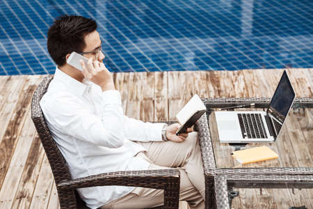 Business Concept - Young Business man woking on Financial plan.の写真素材