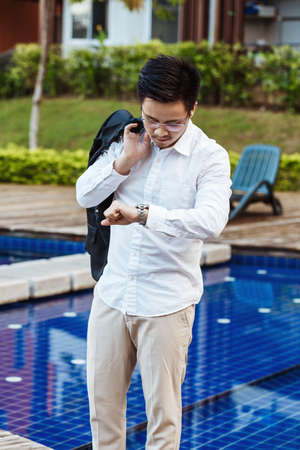 Business Concept - Young Business man checking time for meeting.の写真素材