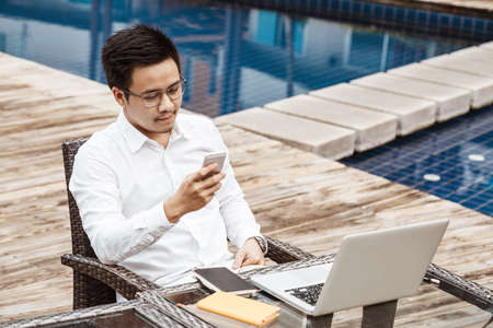 Business Concept - Young Business man woking on Financial plan.の写真素材