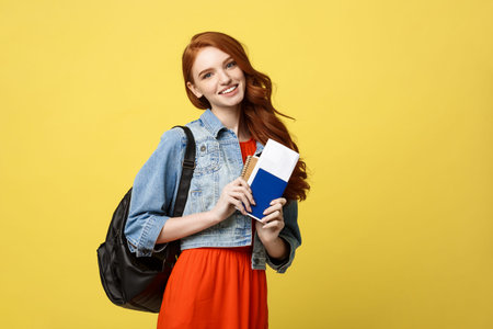 Travel and Lifestyle concept: Full length studio portrait of pretty young student woman holding...