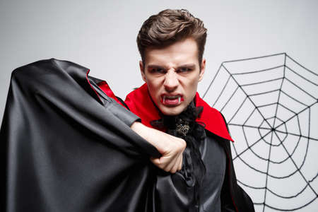 Vampire Halloween Concept - Portrait of Angry caucasian vampire screaming.の写真素材