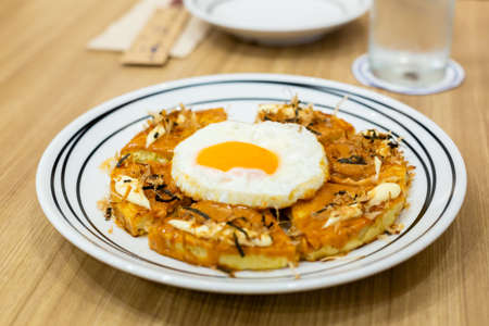 Okonomiyaki, Japanese Pizza on the wooden table.の写真素材