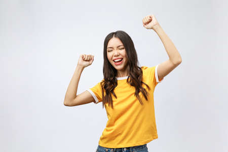 Asian women happiness hand up with winning or success something.の写真素材