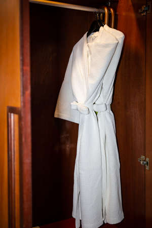 Close up of twins bathrobe in wardrobe backgroundの写真素材