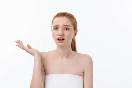 Portrait sad serious young woman with disappointed facial expression.. isolated on white background, looking at cameraの写真素材