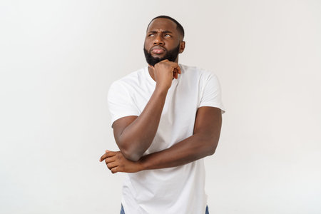 Human face expressions, emotions and feelings. Handsome young African American man looking up with...