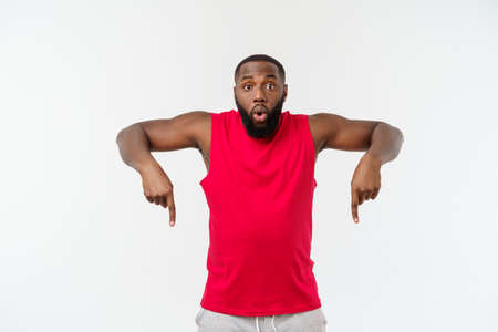 Young african american sport man pointing finger with surprised, feels successful and prosperousの写真素材