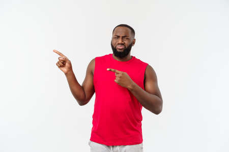 African-American man with sport wear pointing fingers with unhappy emotion.の写真素材