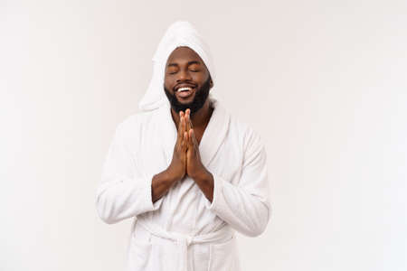 Young african american man in bathrobe screaming proud and celebrating victory and success very excited, cheering emotionの写真素材