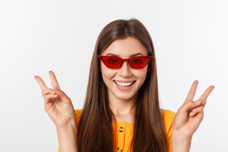 Fashion girl hipster in glasses. White background isolated.