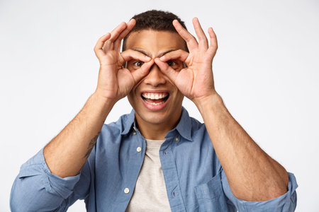 Man always be kids. Cheerful and funny young father fool around and playing with child, making...