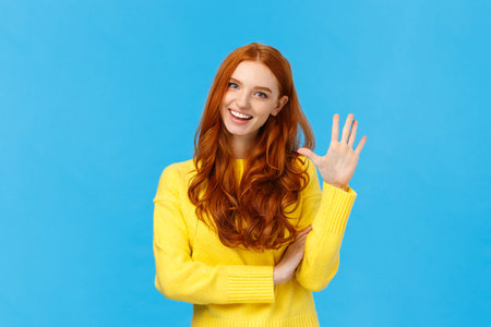 Cheerful, charismatic friendly redhead female showing high five, number fifth as making order,...
