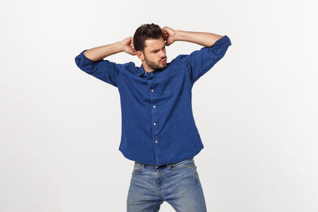 Charming handsome. Handsome young man in casual wear while standing isolated on white background