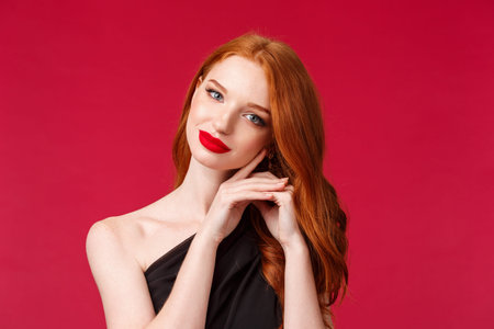 Close-up portrait of gorgeous feminine woman apply makeup, red lipstick, evening dress, look tender...