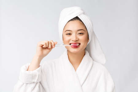 Close up of Smile woman brush teeth. great for health dental care concept, Isolated over white background. asian.の写真素材