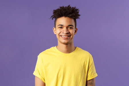 Close-up portrait of smiling, enthusiastic hispanic male student searching job, consider career...