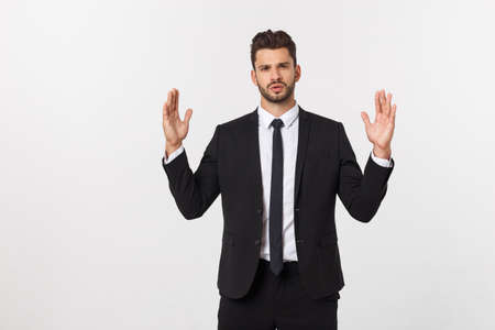 A man shows with his hands a large size on an isolated backgroundの写真素材